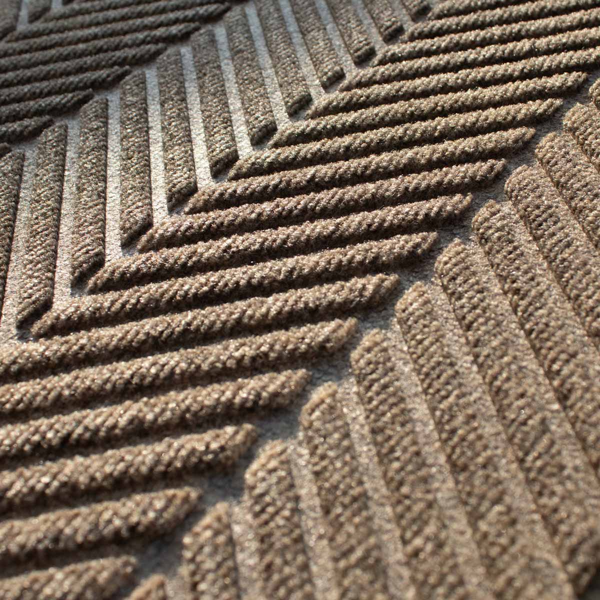 closeup on the colour and texture of a waterhog herringbone doormat