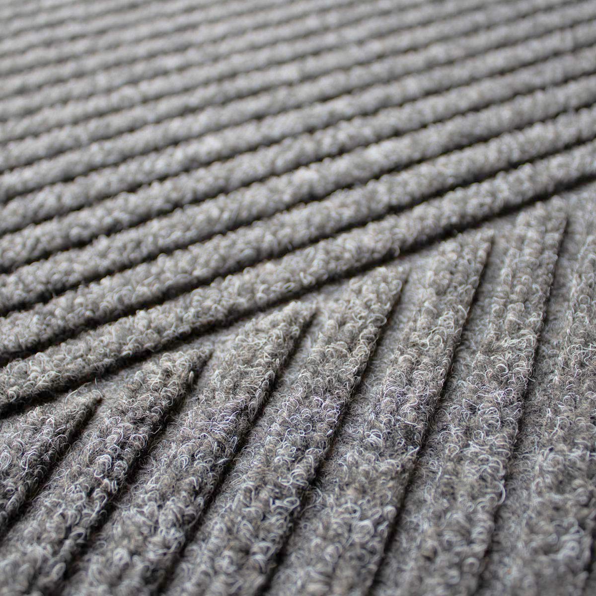 Close-up of a textured gray carpet surface