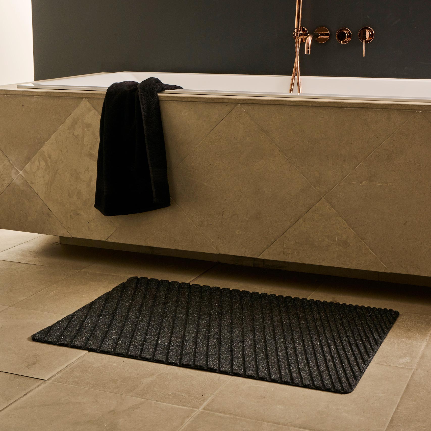 degradee waterhog charcoal doormat in a bathroom