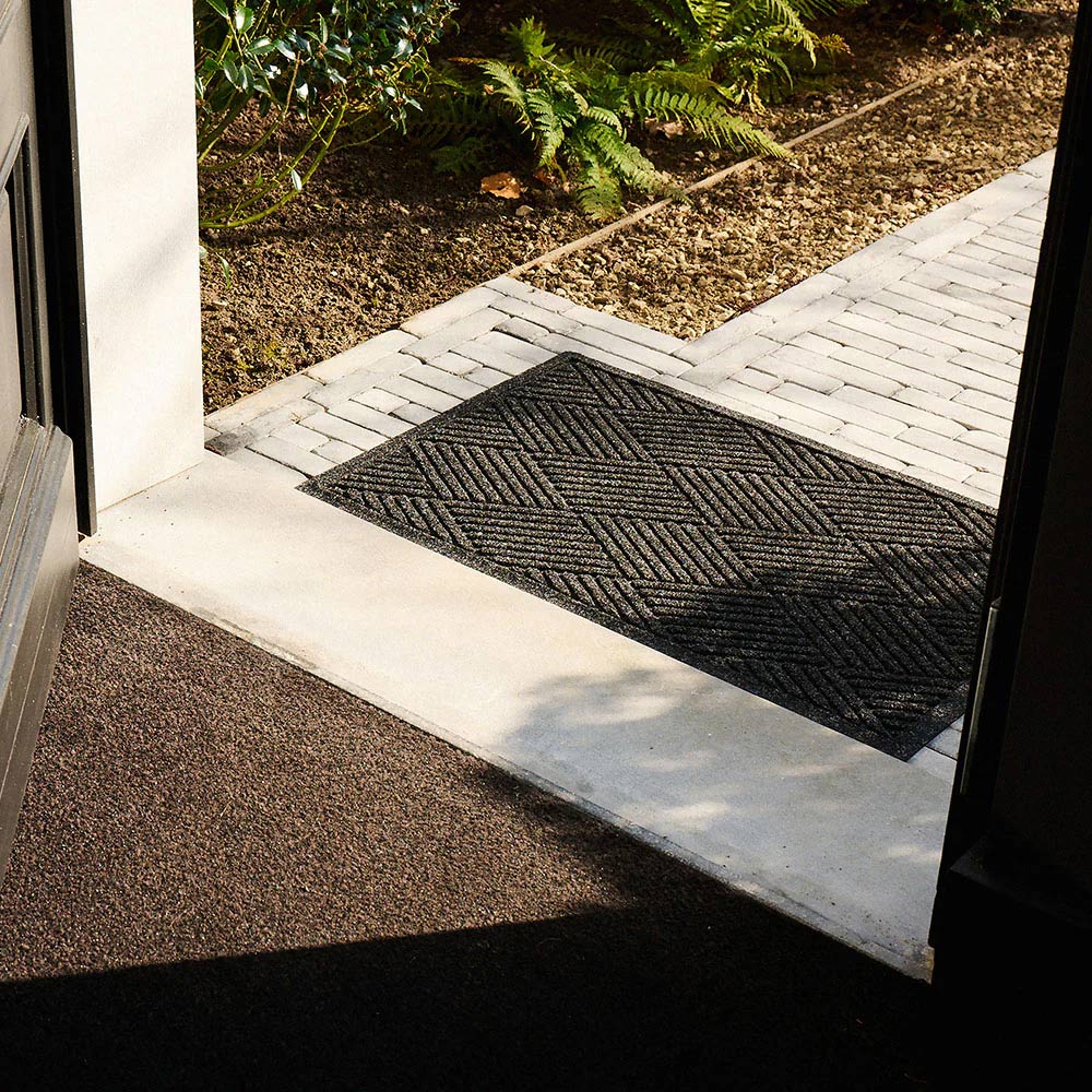 waterhog diamond charcoal doormat in a luxurious entrance