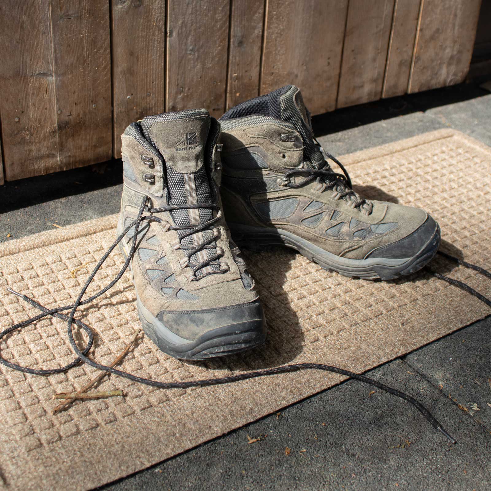 hiking shoes on a waterhog boot tray mat