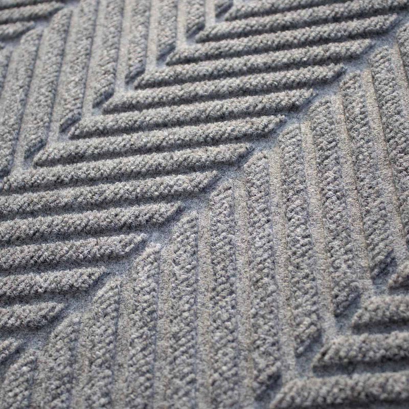 closeup on the colour and texture of a waterhog herringbone doormat