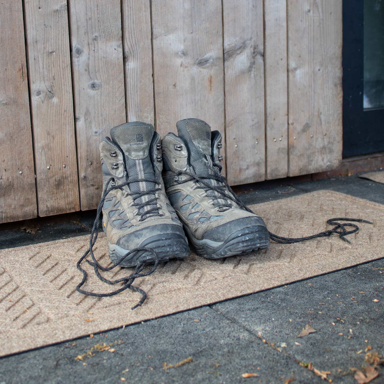 hiking shoes on a waterhog boot tray mat