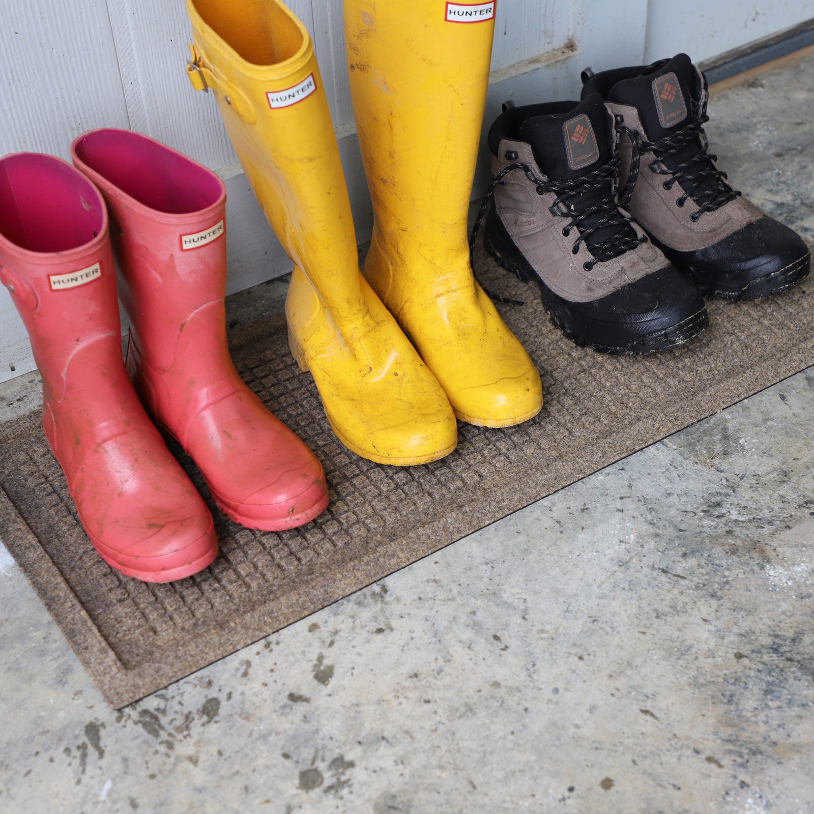 hiking shoes and boots on a waterhog boot tray mat