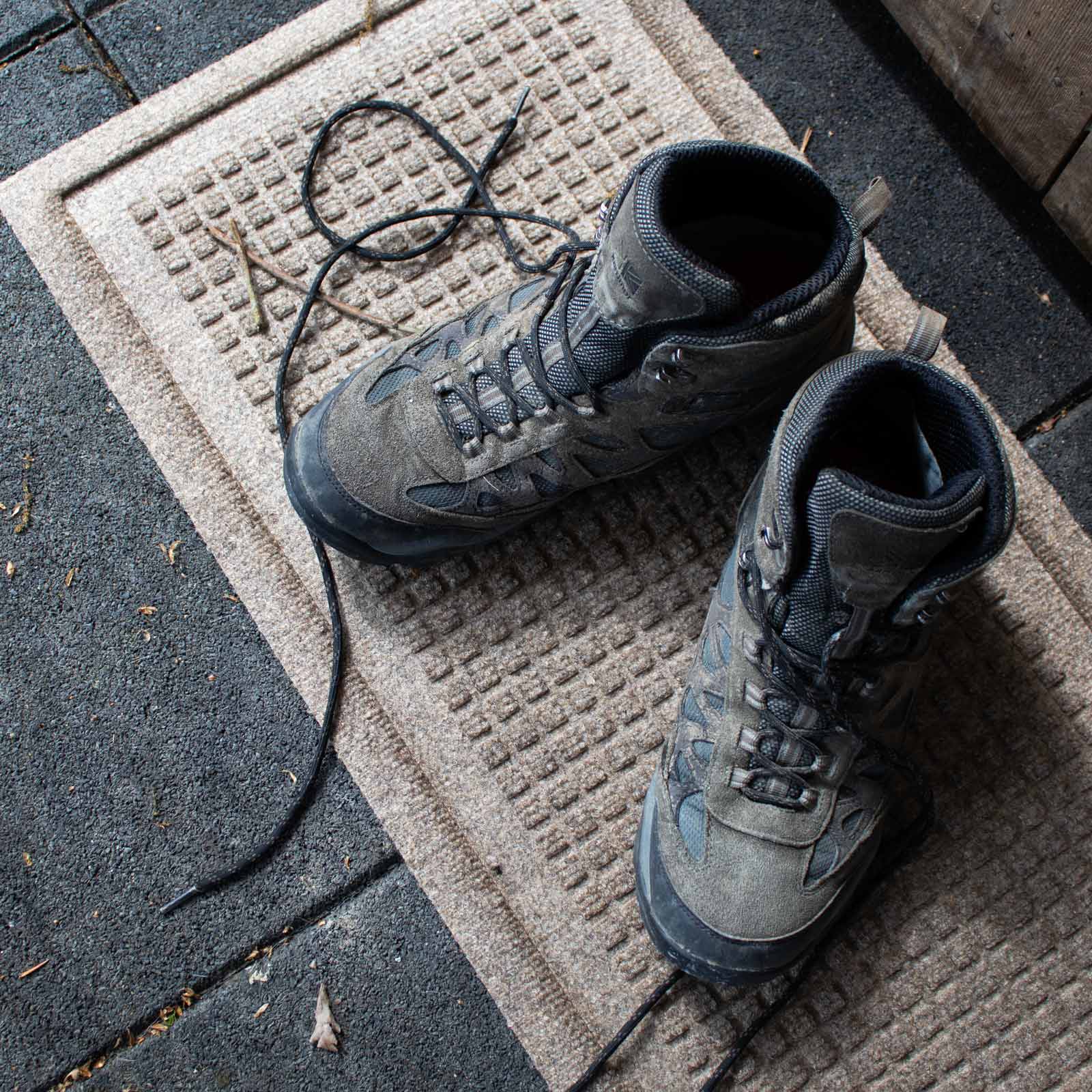 hiking shoes on a waterhog boot tray mat