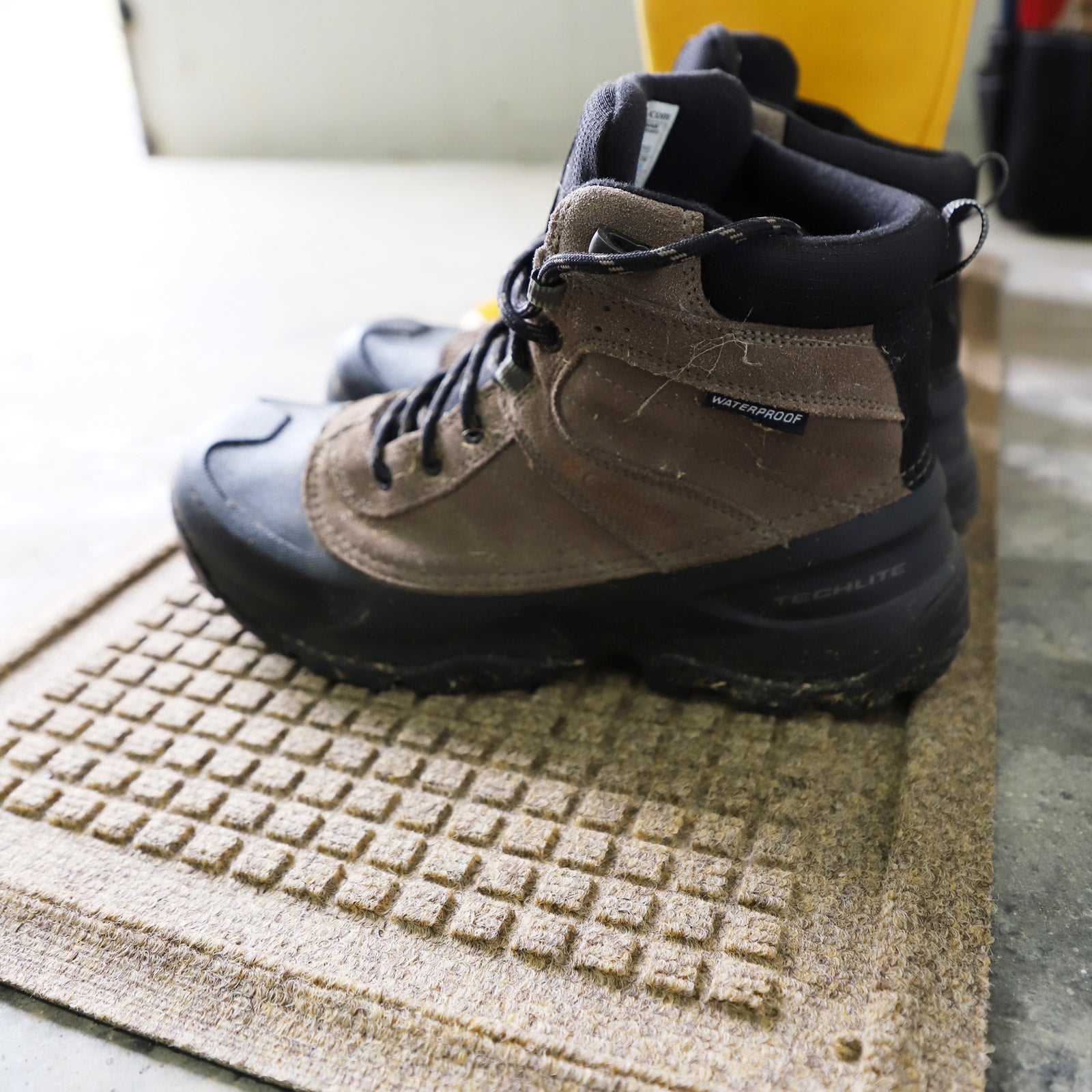 hiking shoes on a waterhog boot tray mat
