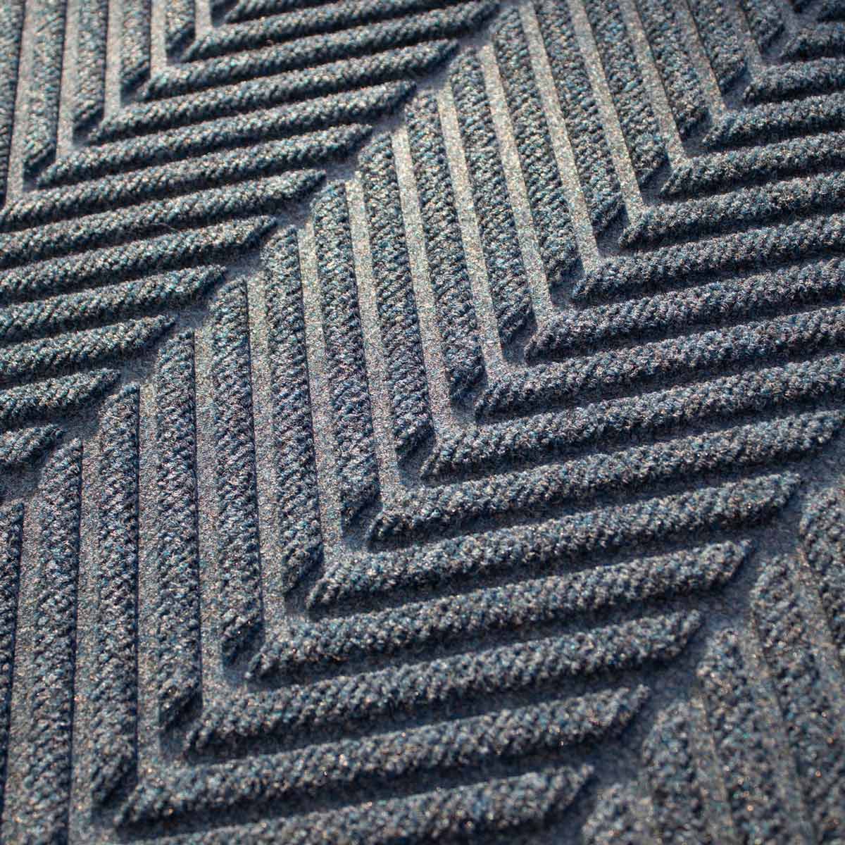 closeup on the colour and texture of a waterhog herringbone doormat