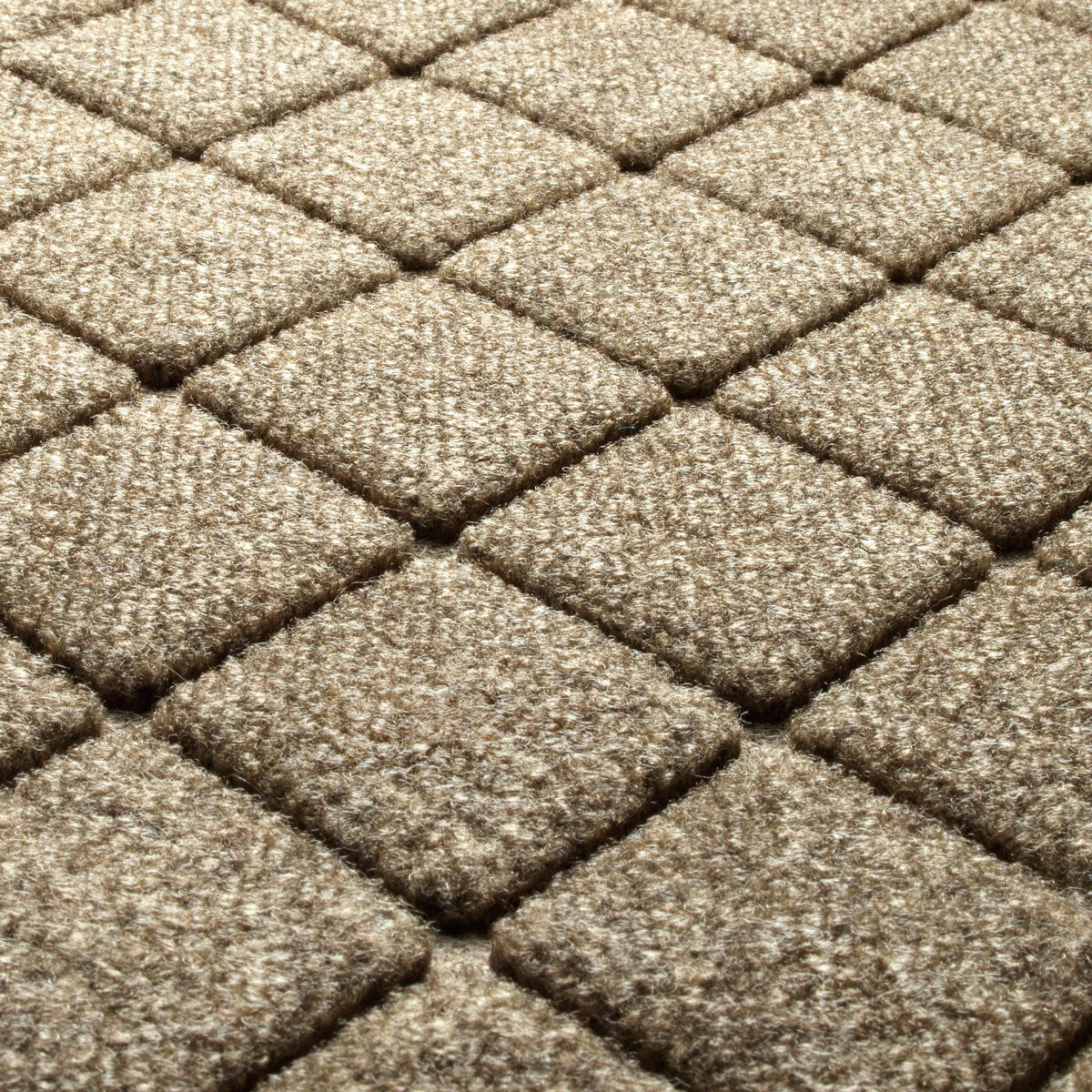 Close-up of diamond-patterned brown carpet